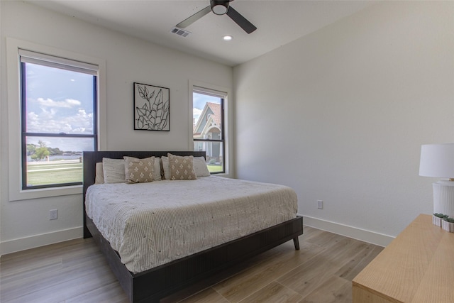 bedroom featuring ceiling fan and light wood-type flooring