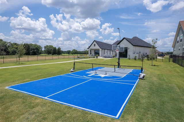 view of basketball court featuring a lawn