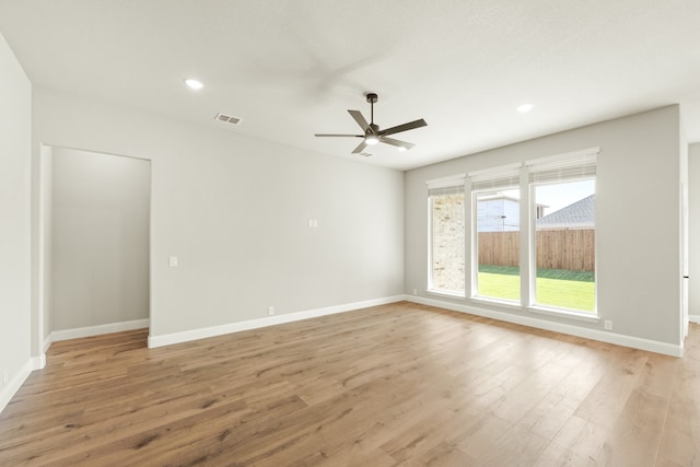 empty room featuring light hardwood / wood-style floors and ceiling fan