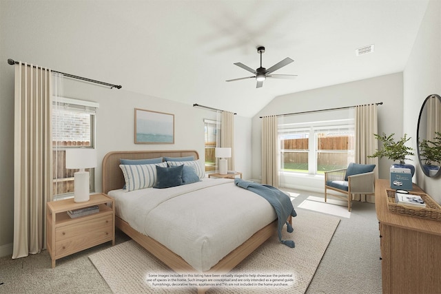 carpeted bedroom featuring vaulted ceiling and ceiling fan