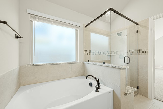 bathroom featuring independent shower and bath and tile patterned floors