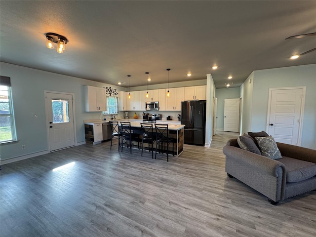 2813 Catfish Ct, Granbury, TX 76048 - living room featuring recessed lighting and light wood-type flooring