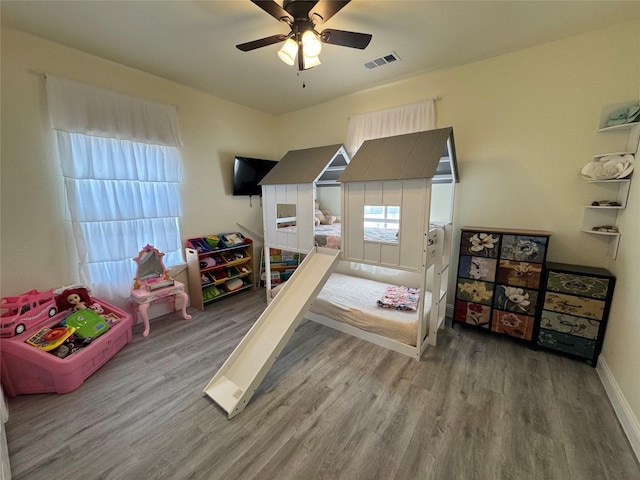 bedroom with ceiling fan and hardwood / wood-style floors