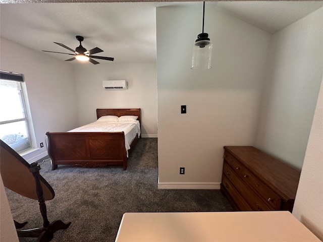 bedroom featuring baseboards, lofted ceiling, ceiling fan, a wall mounted air conditioner, and dark colored carpet