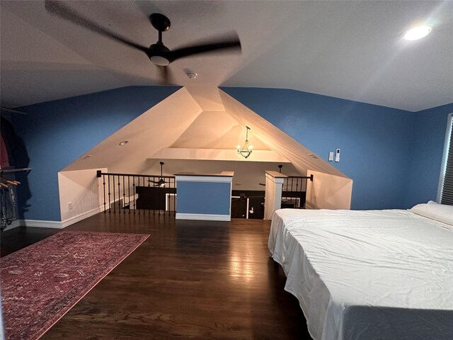 bedroom featuring ceiling fan, dark hardwood / wood-style flooring, and lofted ceiling