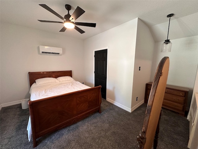 bedroom featuring ceiling fan, baseboards, vaulted ceiling, and a wall mounted air conditioner