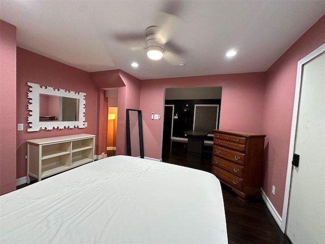 bedroom featuring baseboards, dark wood finished floors, a ceiling fan, and recessed lighting