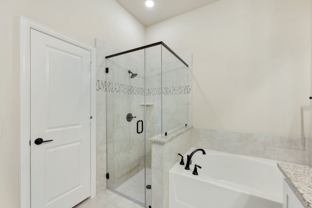 bathroom with vanity and independent shower and bath