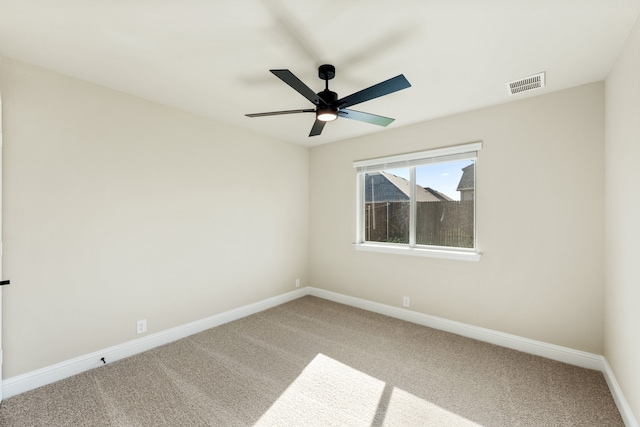 carpeted empty room with ceiling fan