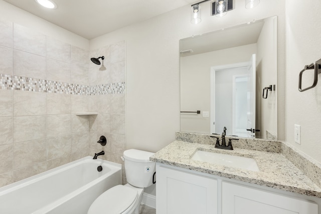 full bathroom featuring vanity, toilet, and tiled shower / bath