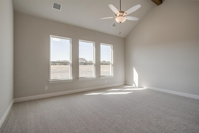 empty room with carpet, high vaulted ceiling, and ceiling fan