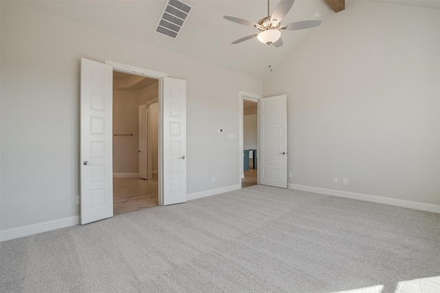 unfurnished bedroom with beamed ceiling, light carpet, high vaulted ceiling, and ceiling fan