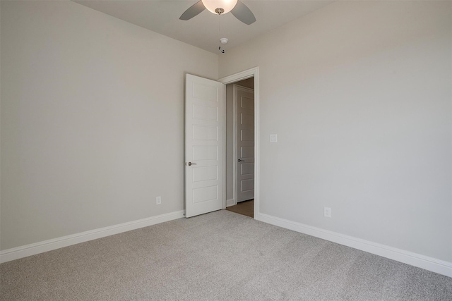 unfurnished room with ceiling fan and carpet floors