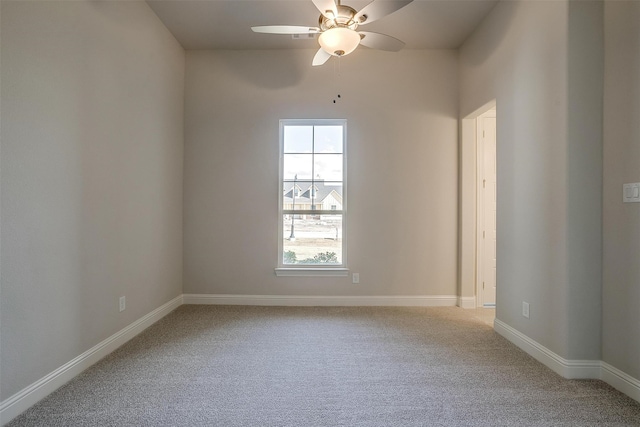 empty room with carpet floors and ceiling fan