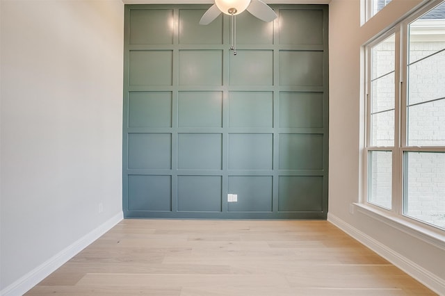 spare room featuring light hardwood / wood-style floors and ceiling fan