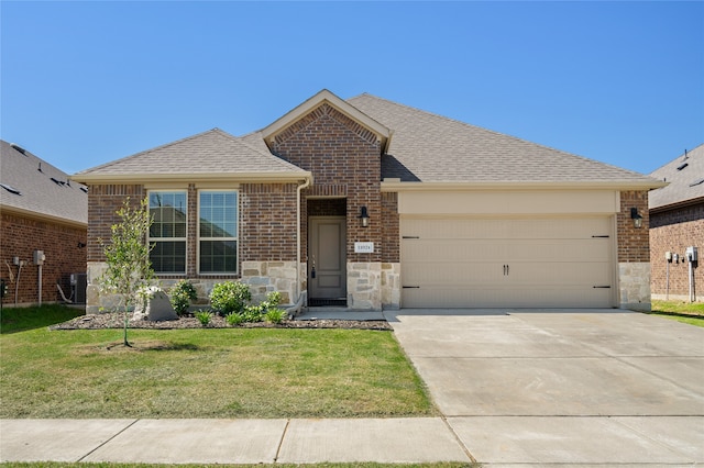 11024 Los Alamos Dr, Aubrey, TX 76227 - view of front facade featuring stone siding, an attached garage, a front yard, and brick siding