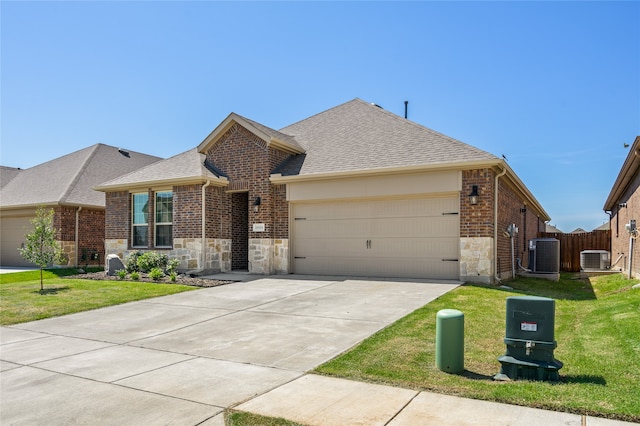 ranch-style home featuring a front yard, a garage, and central AC