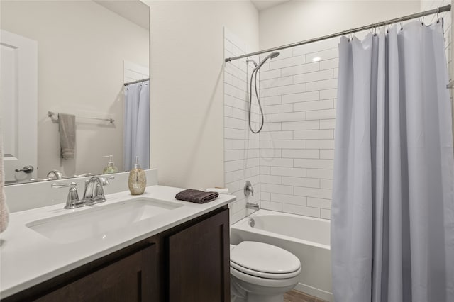 full bathroom featuring shower / tub combo with curtain, oversized vanity, and toilet