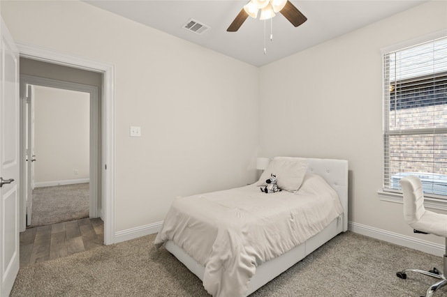 bedroom with ceiling fan and hardwood / wood-style flooring