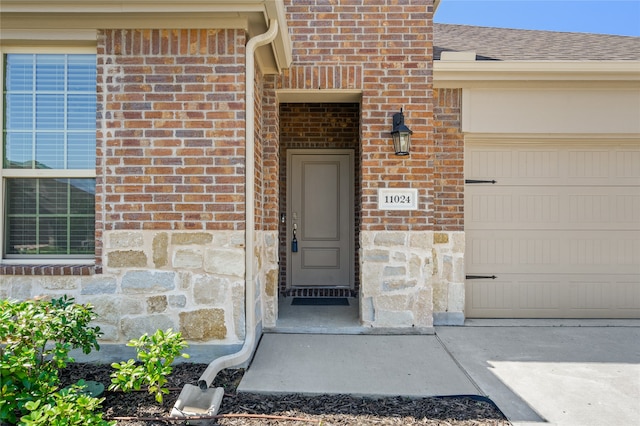 property entrance featuring a garage