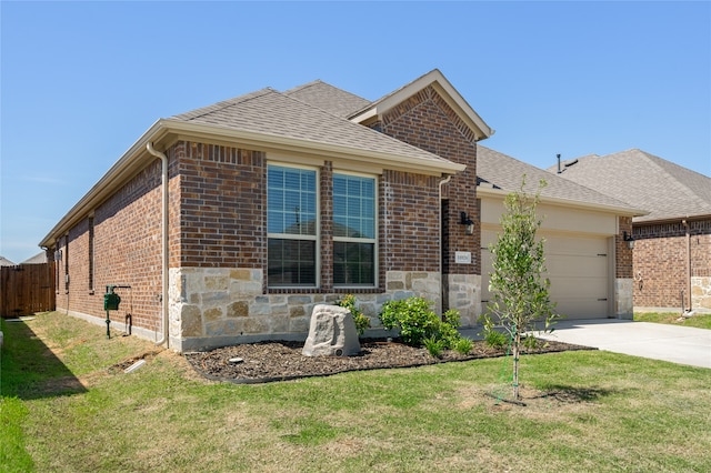 view of front facade with a garage and a front lawn