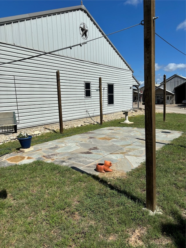 view of outdoor structure with a lawn