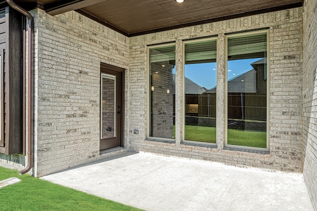 doorway to property featuring a patio