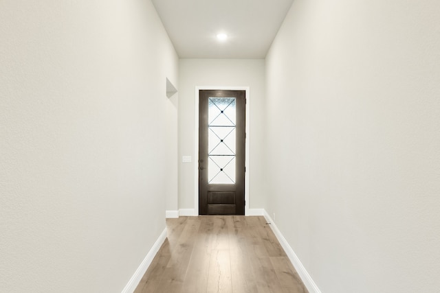 doorway with light wood-type flooring