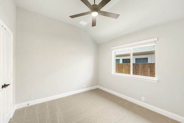 unfurnished room with ceiling fan, carpet, and lofted ceiling