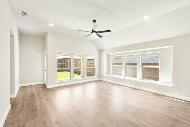 unfurnished living room featuring lofted ceiling, light hardwood / wood-style flooring, and ceiling fan