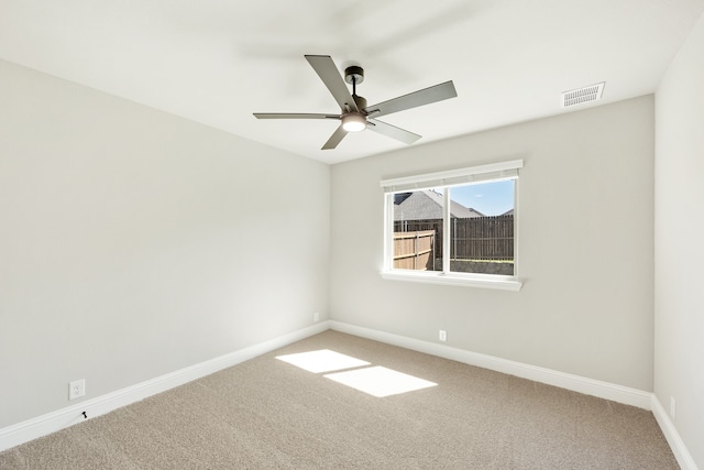 carpeted empty room with ceiling fan