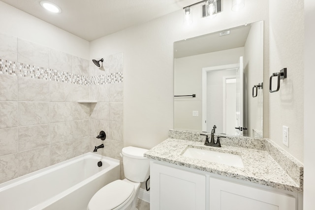 full bathroom with vanity, toilet, and tiled shower / bath combo