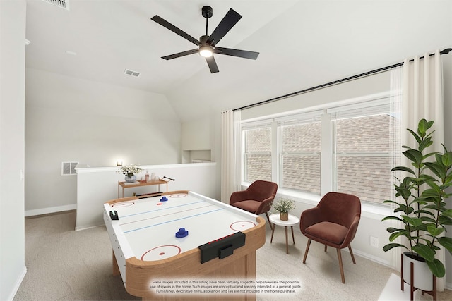 playroom with light carpet, lofted ceiling, and ceiling fan