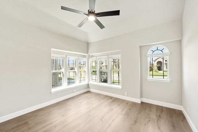 spare room featuring light hardwood / wood-style flooring and ceiling fan