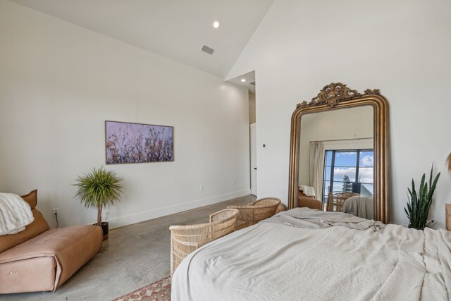 bedroom featuring high vaulted ceiling, multiple windows, and access to exterior