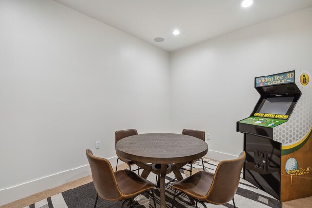 carpeted living room with ceiling fan