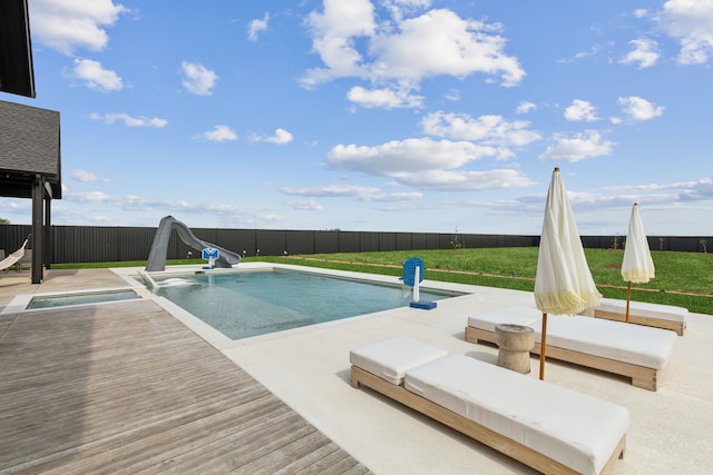 view of pool featuring a water slide and a wooden deck