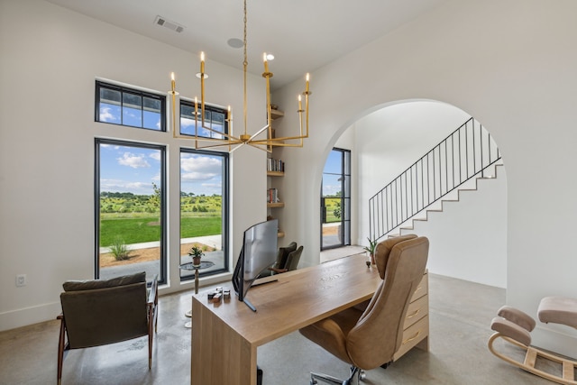 office area featuring plenty of natural light and a notable chandelier