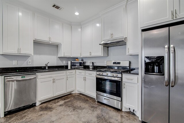 kitchen featuring dark stone countertops, sink, appliances with stainless steel finishes, and white cabinetry