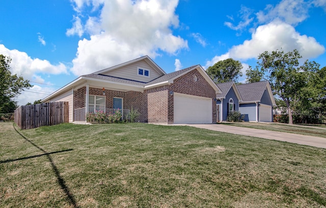 view of front facade with a garage and a front yard