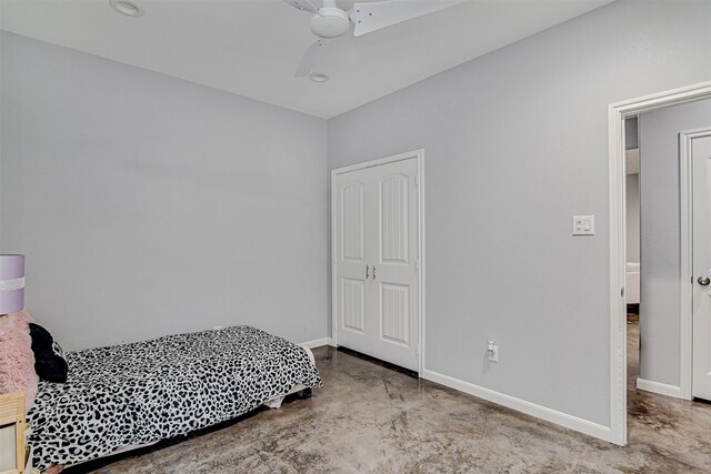 bedroom with ceiling fan and a closet