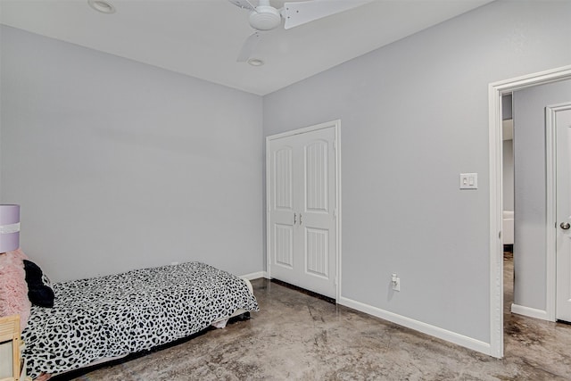 bedroom with baseboards, ceiling fan, and finished concrete floors