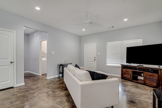 living room with concrete flooring and ceiling fan