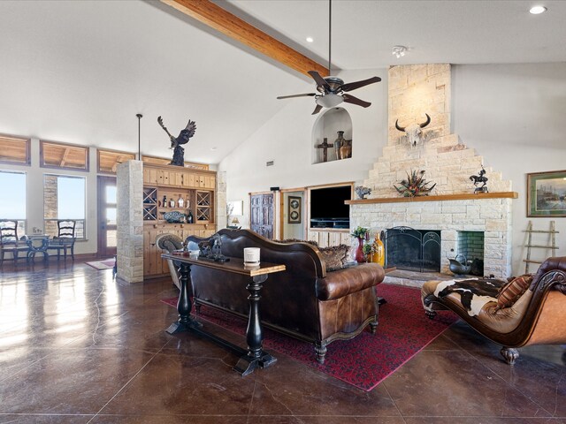 living room featuring a stone fireplace, beam ceiling, ceiling fan, and high vaulted ceiling