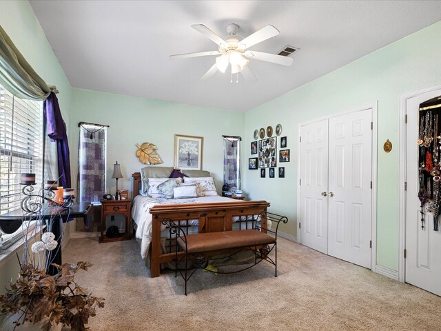 carpeted bedroom with ceiling fan