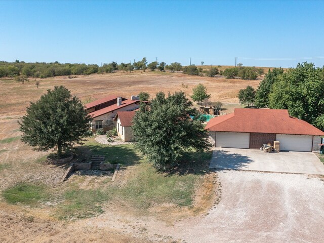 birds eye view of property featuring a rural view