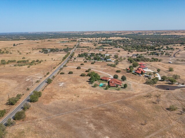 birds eye view of property featuring a rural view