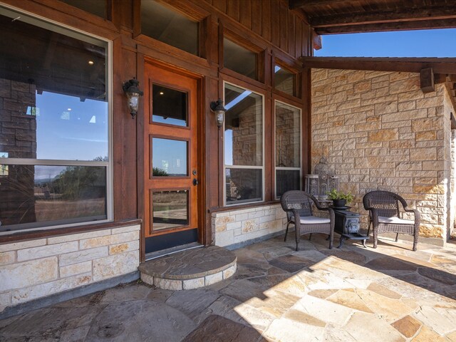 entrance to property with a patio area