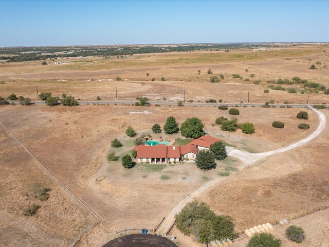 birds eye view of property with a rural view