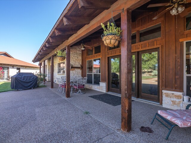 view of patio / terrace featuring area for grilling and ceiling fan